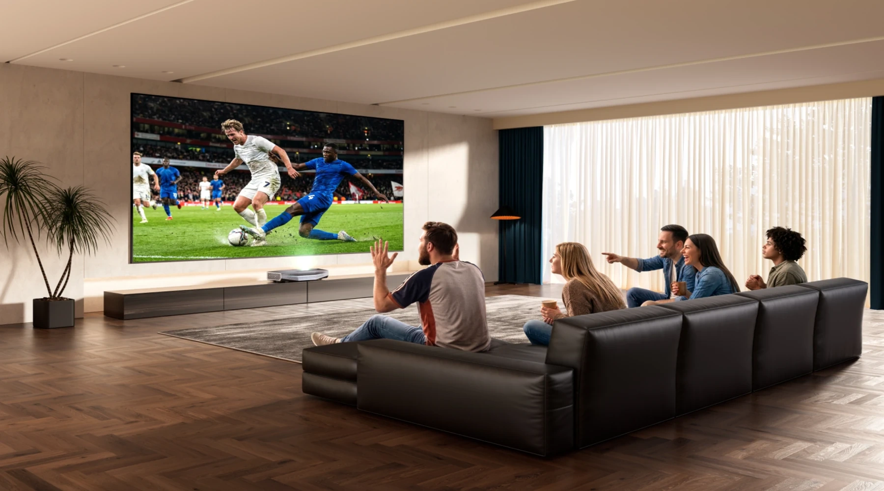 Friends watching football on a large ultra short throw projector screen in a home cinema.